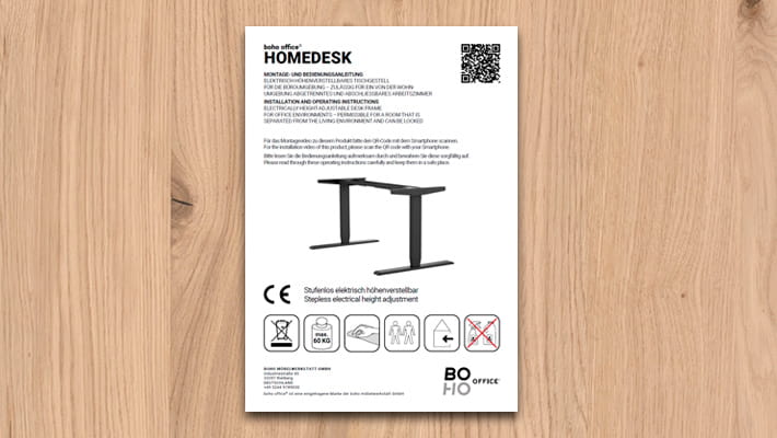 Instructions de montage pour le bureau HOMEDESK réglable en hauteur électriquement avec code QR et consignes de sécurité.